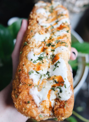 a close up of food chicken Philly cheesesteak