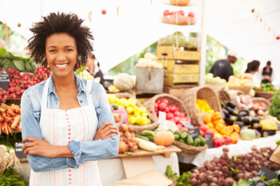 42131605 – female stall holder at farmers fresh food market