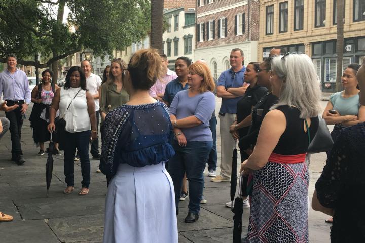 a group of people standing in front of a crowd