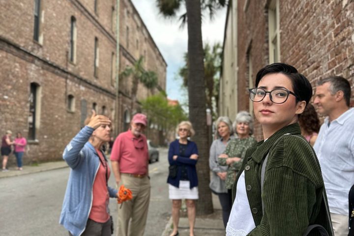 a group of people walking on a city street