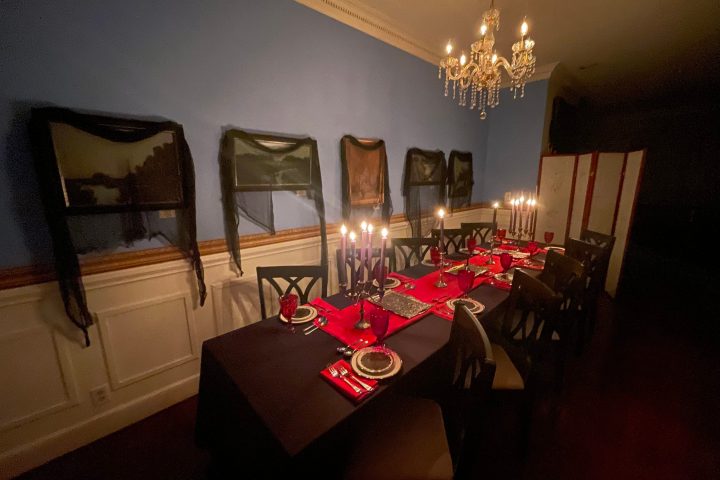 a room filled with furniture and a lamp