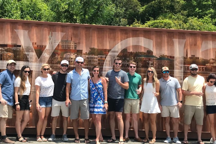 a group of people standing in front of a building