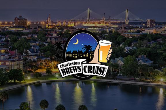 a train crossing a bridge over a body of water