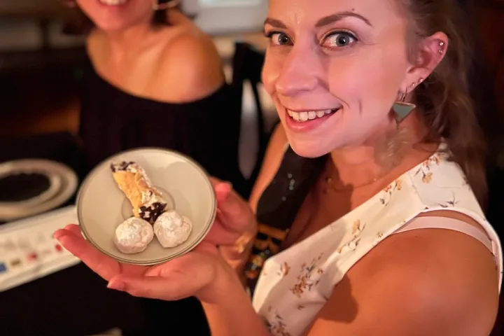 a woman cutting a cake