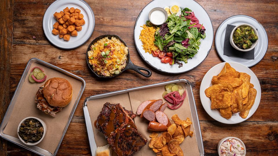 a bunch of food sitting on top of a wooden table