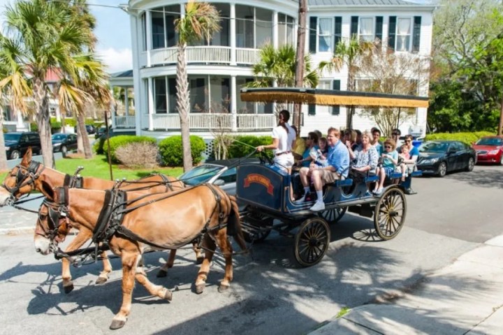a horse drawn carriage in front of a building