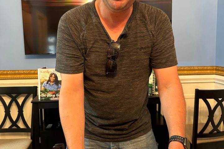 a man sitting at a table with food